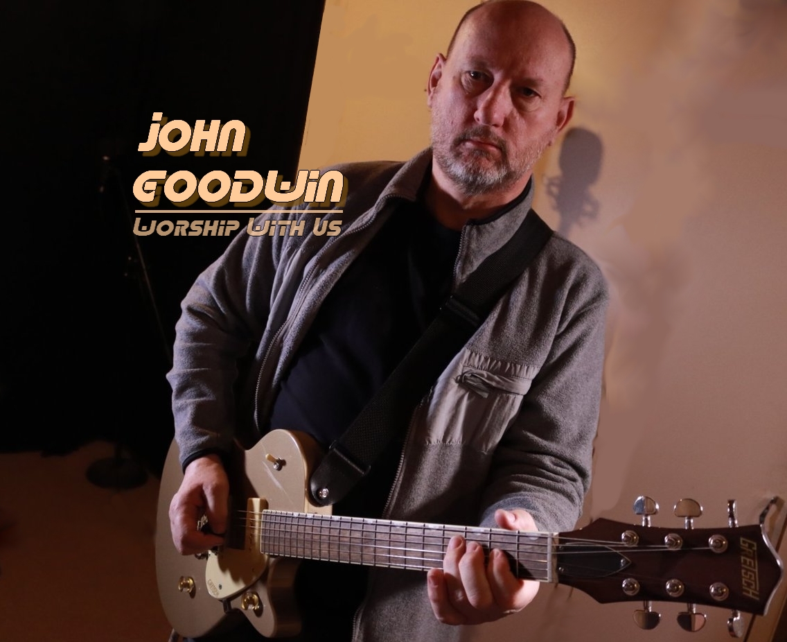John playing the guitar